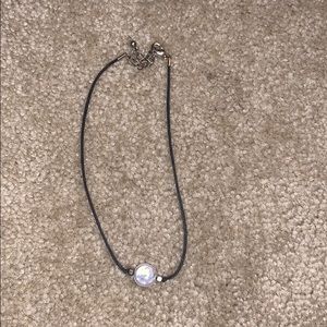 black choker with white pearl